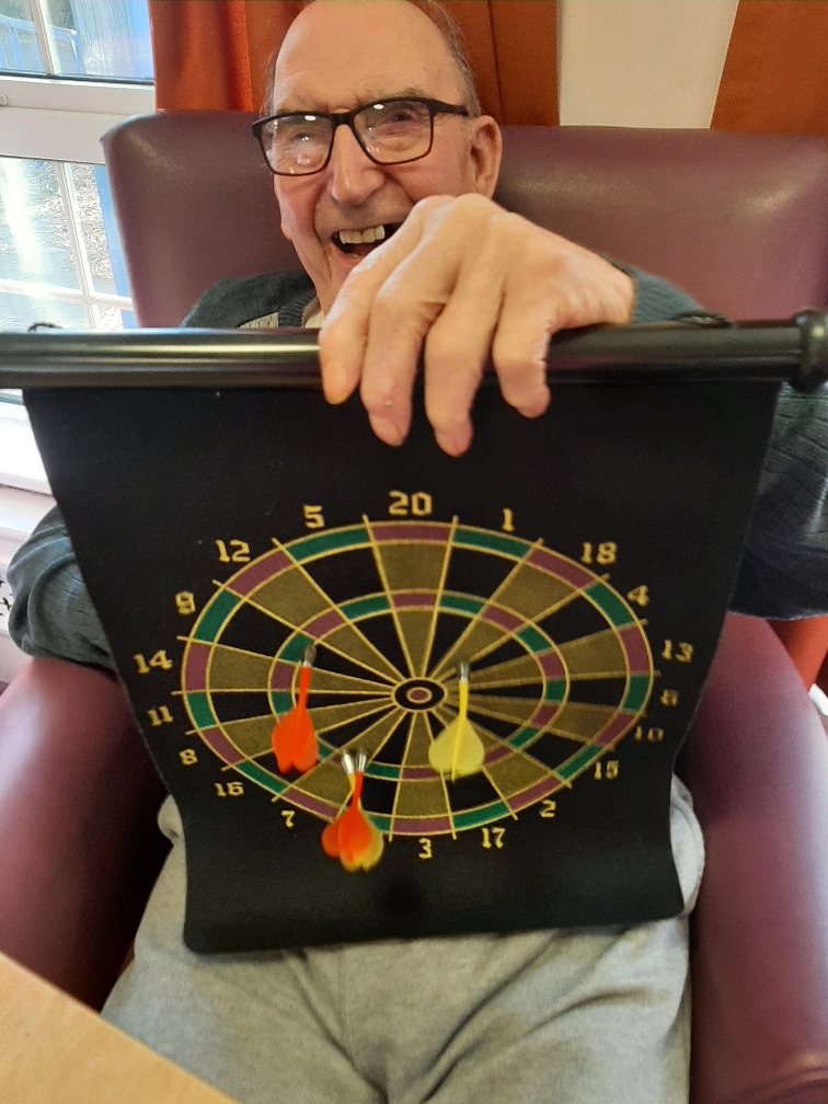 Resident showing his dart board