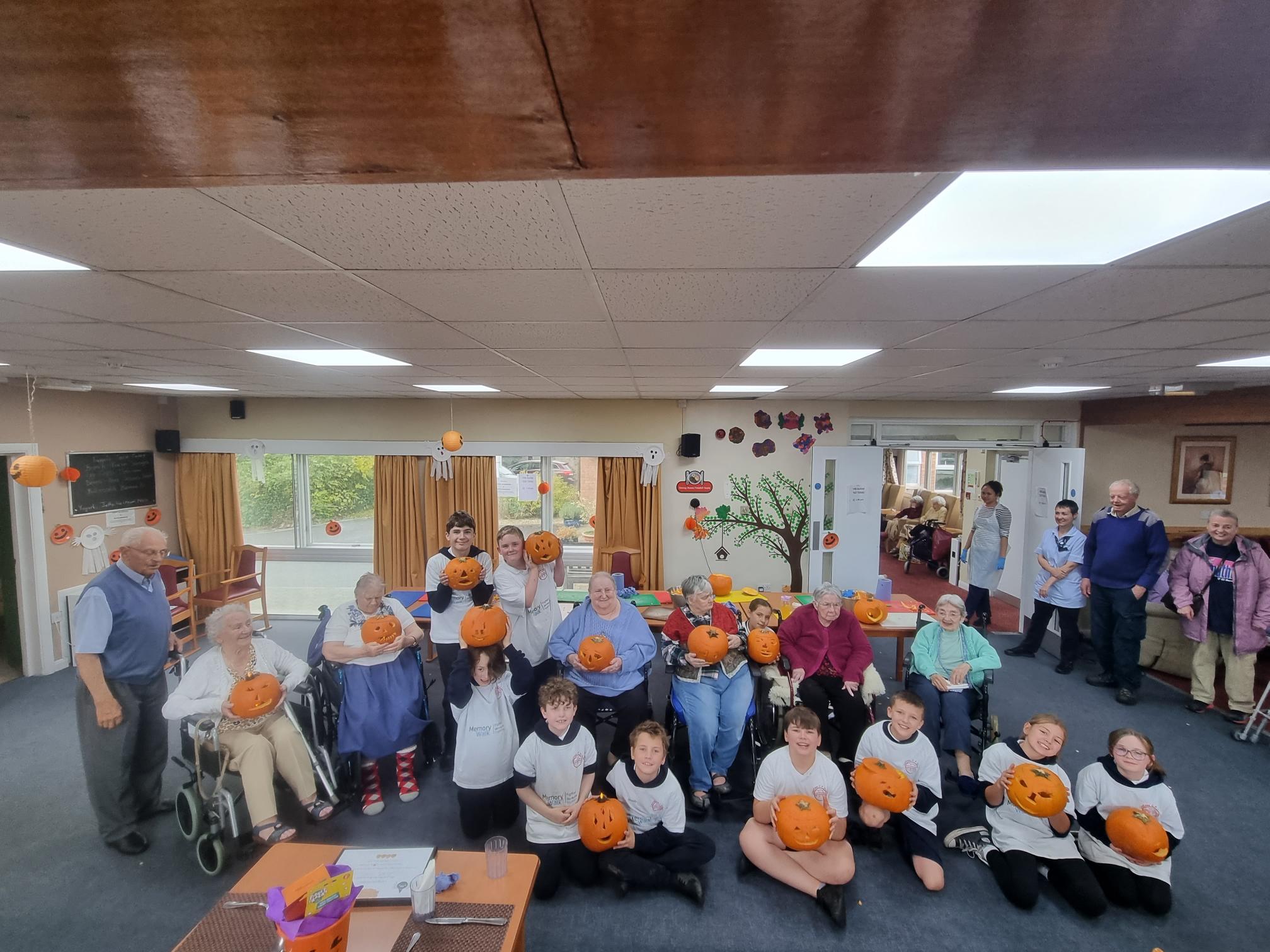 Llanfaes pupils pumpkin carving with residents 