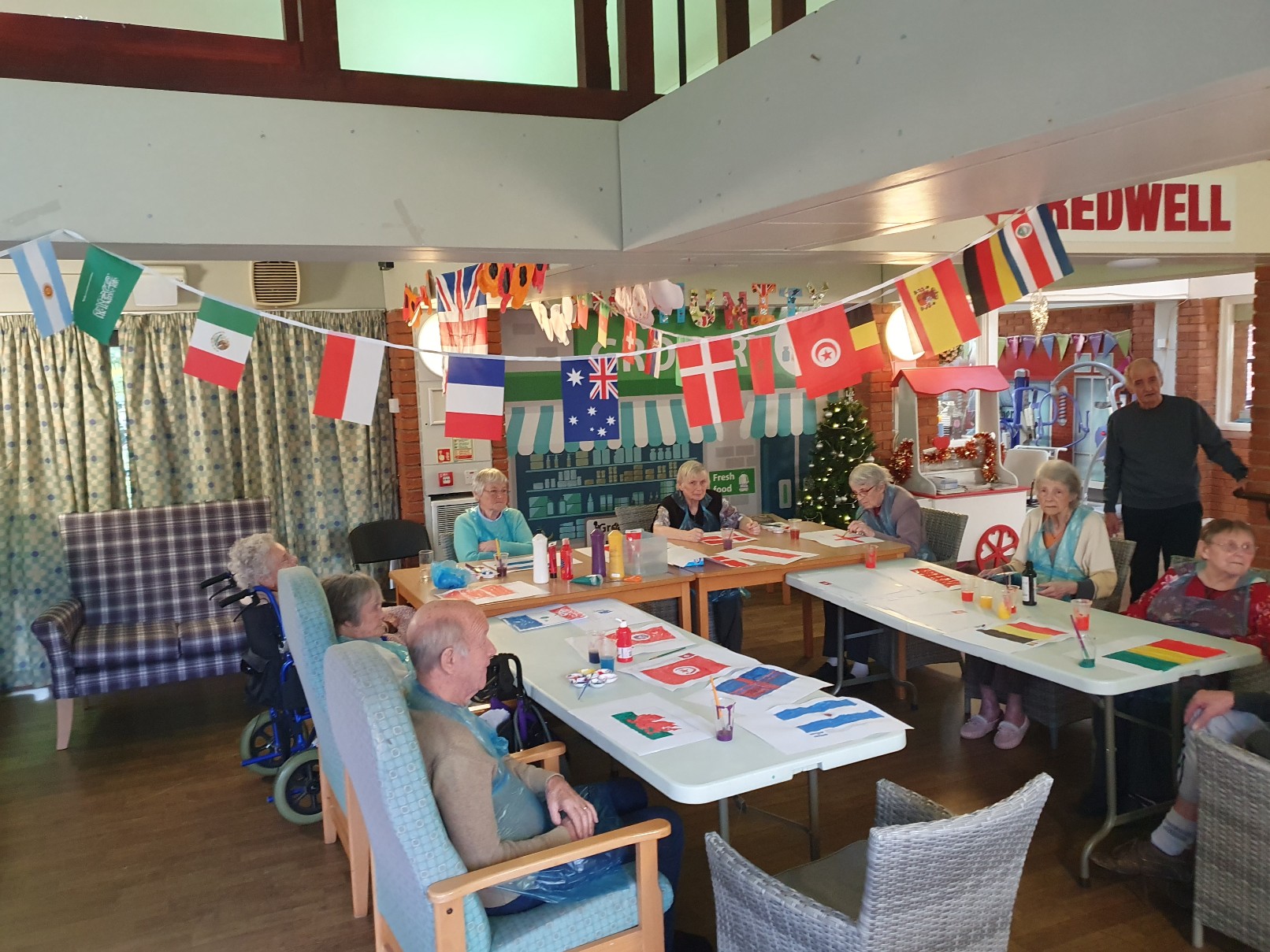 residents decorating and painting flags for the World Cup