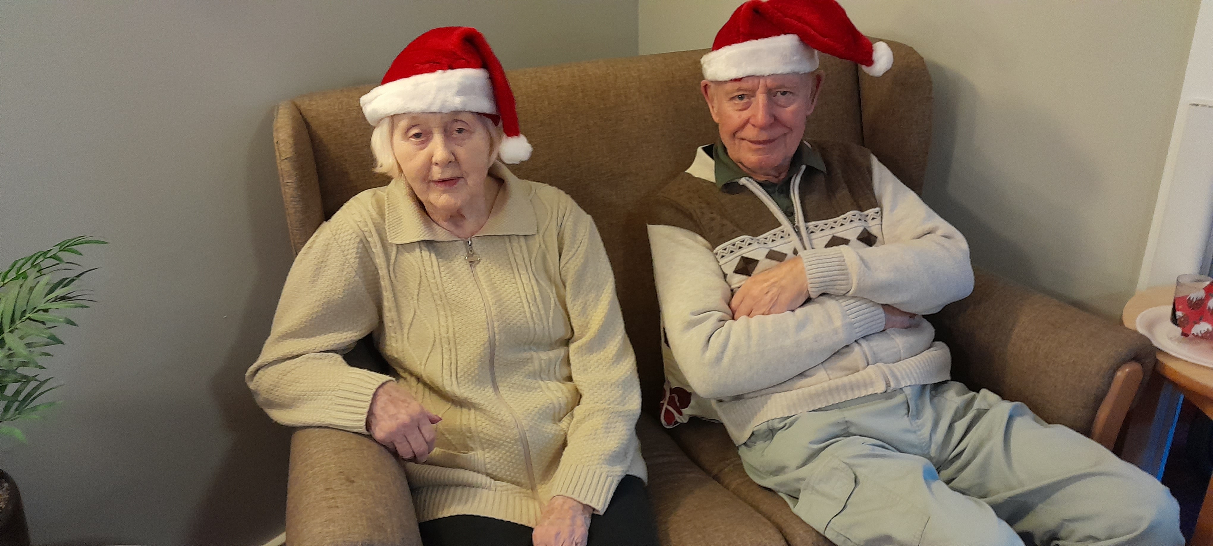 residents with Christmas hats on