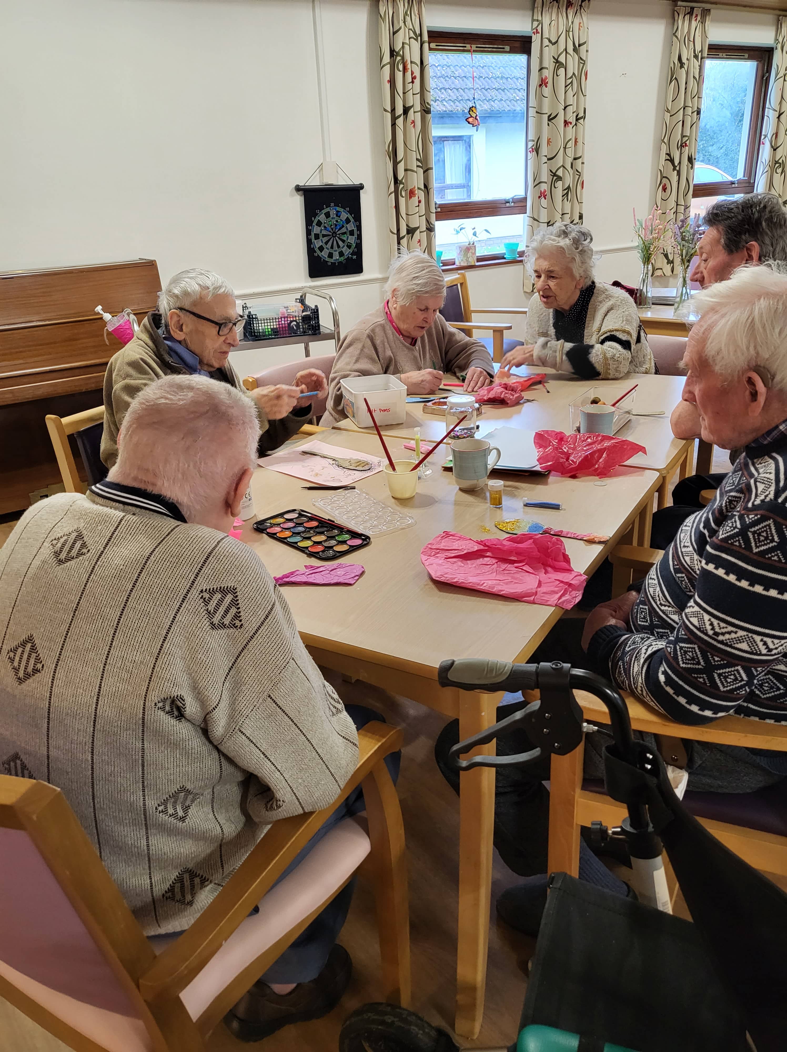 Residents painting love spoons