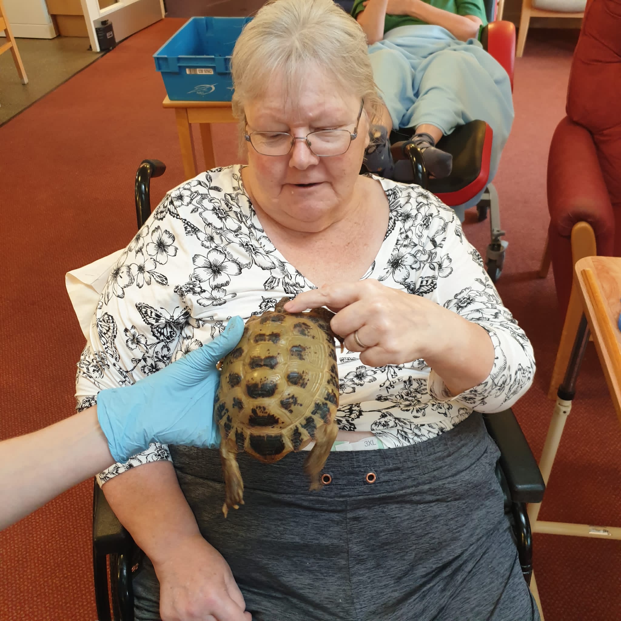 resident with a tortoise 