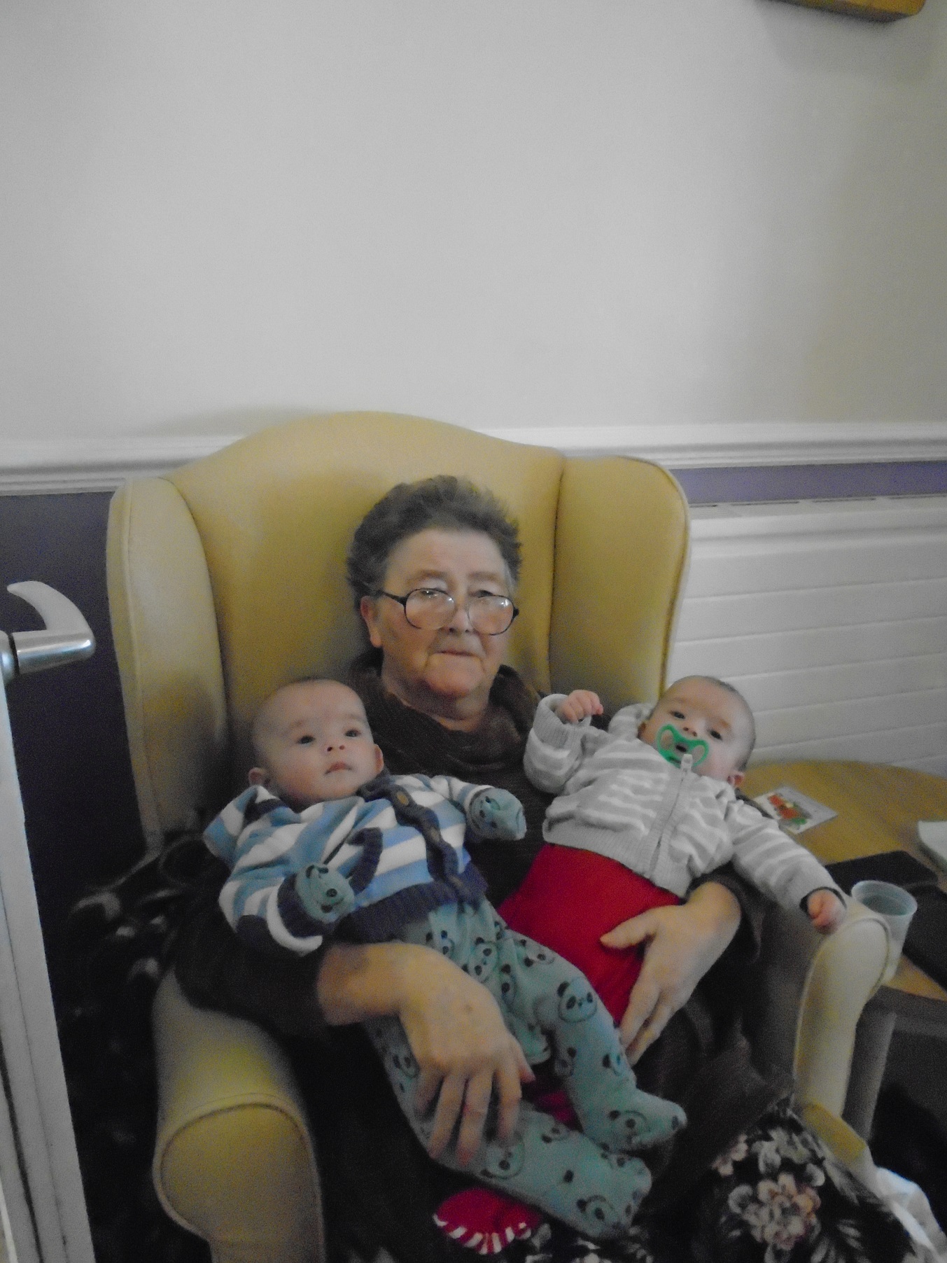 Rose holding her twin grandchildren