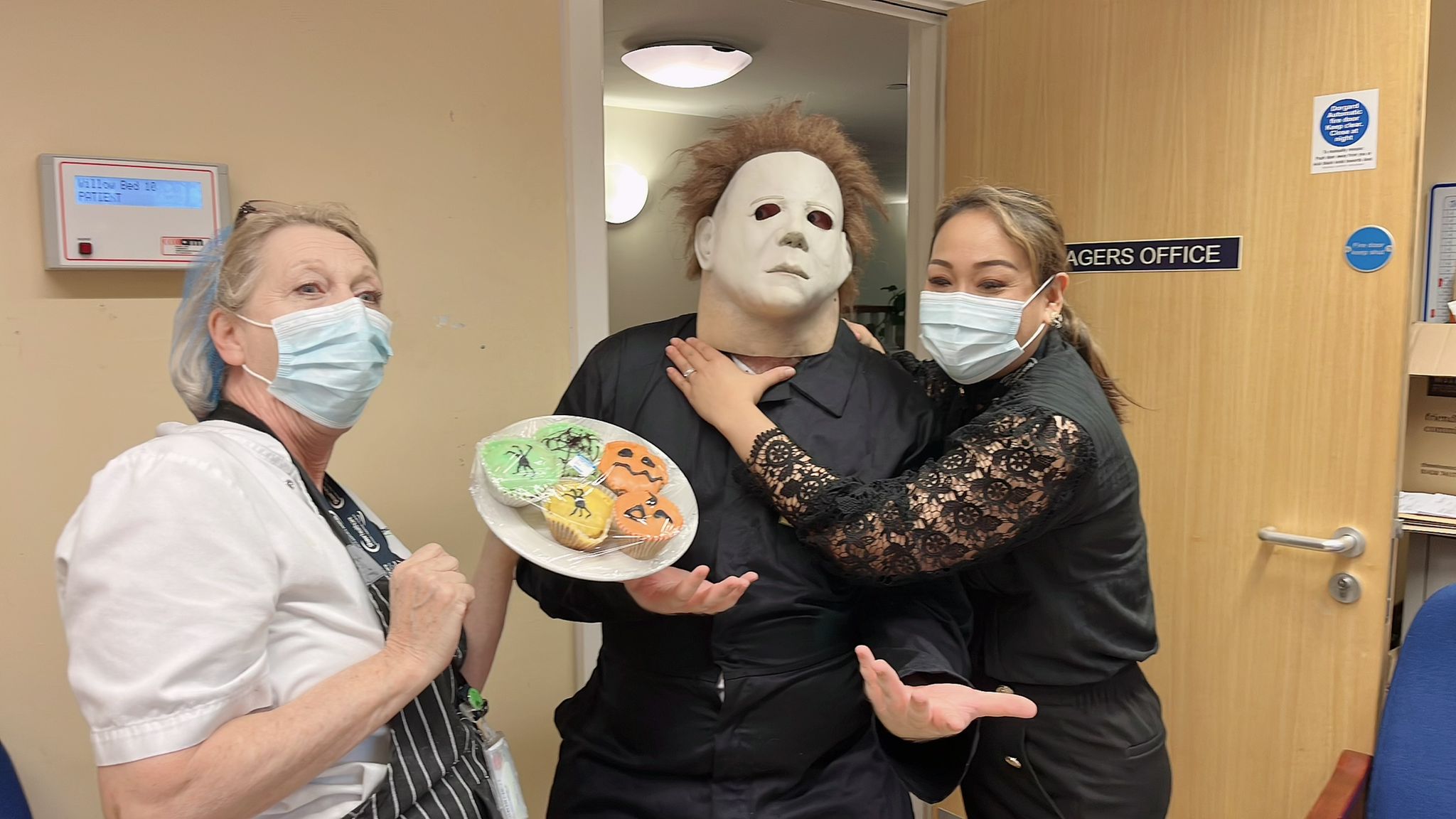 Manager and other employees with Michael Myers 
