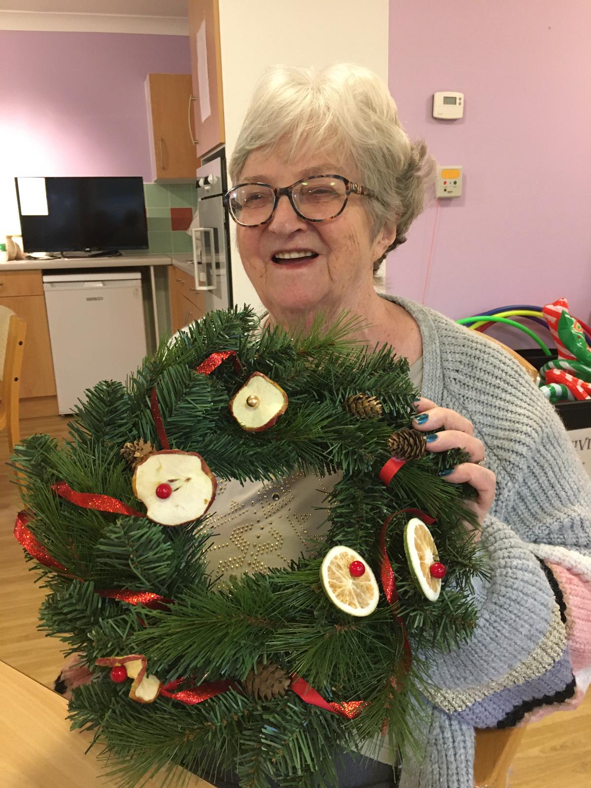 resident with wreath