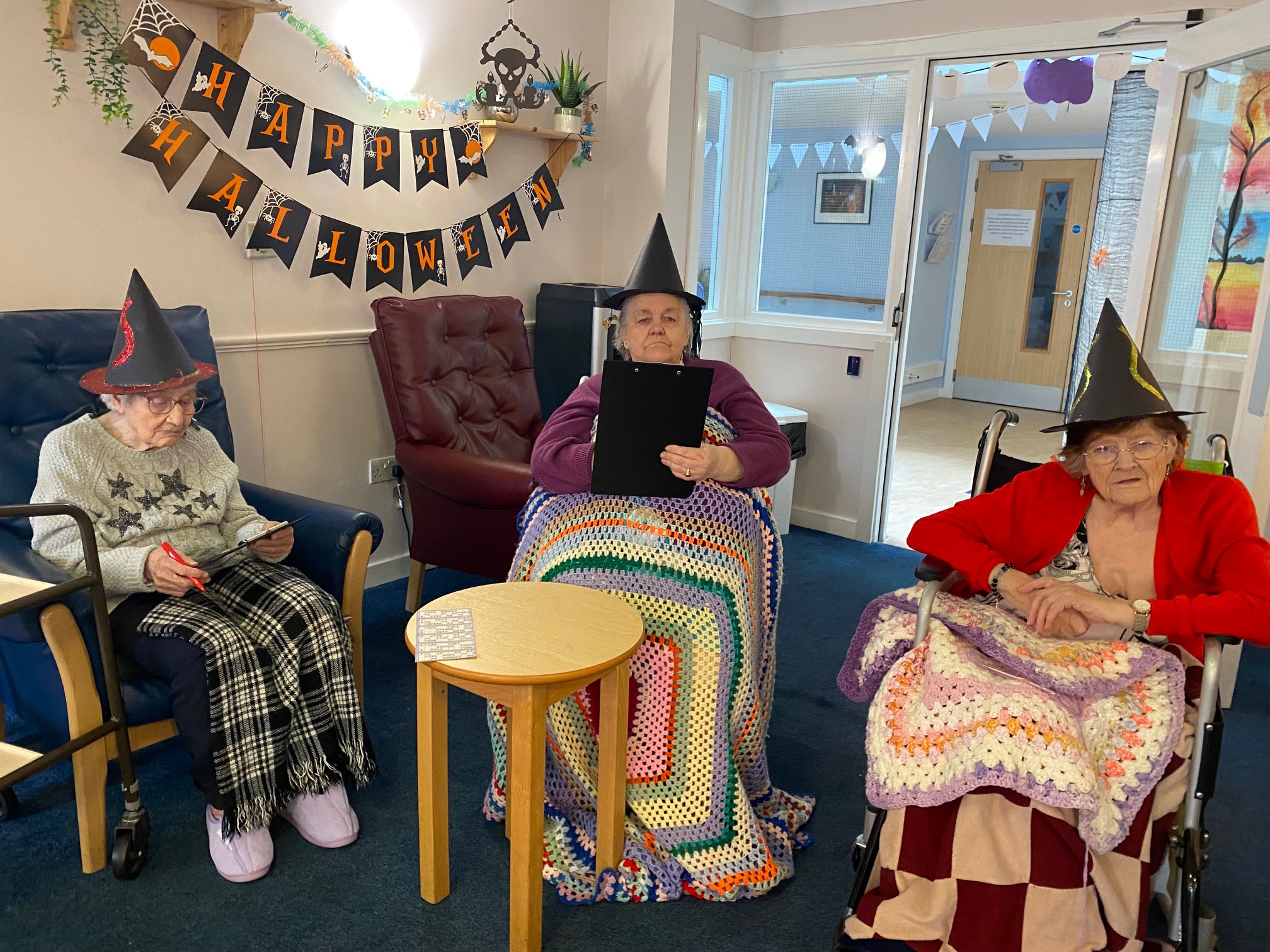 residents with witches' hats on