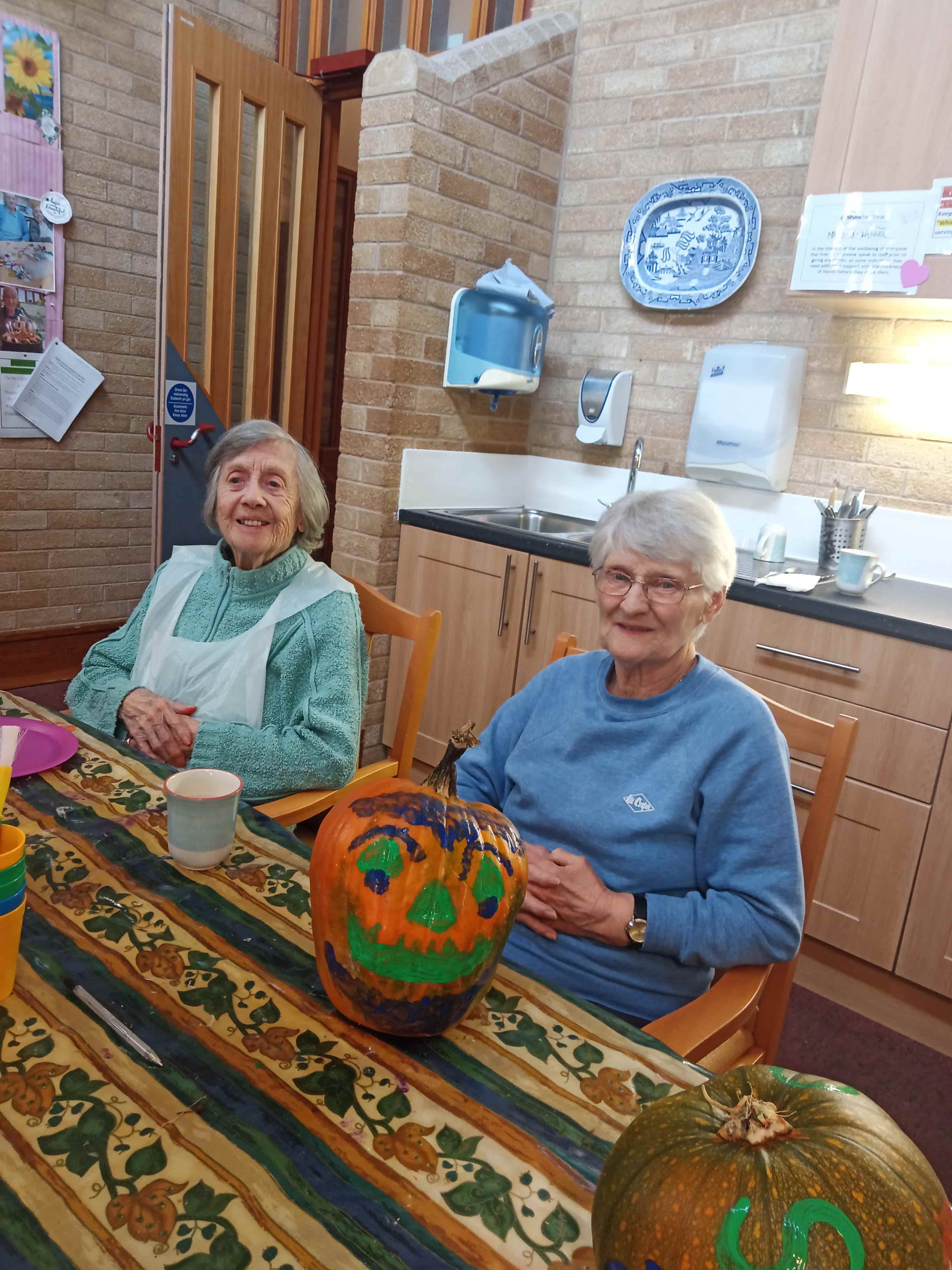 Residents with the pumpkin that they painted 