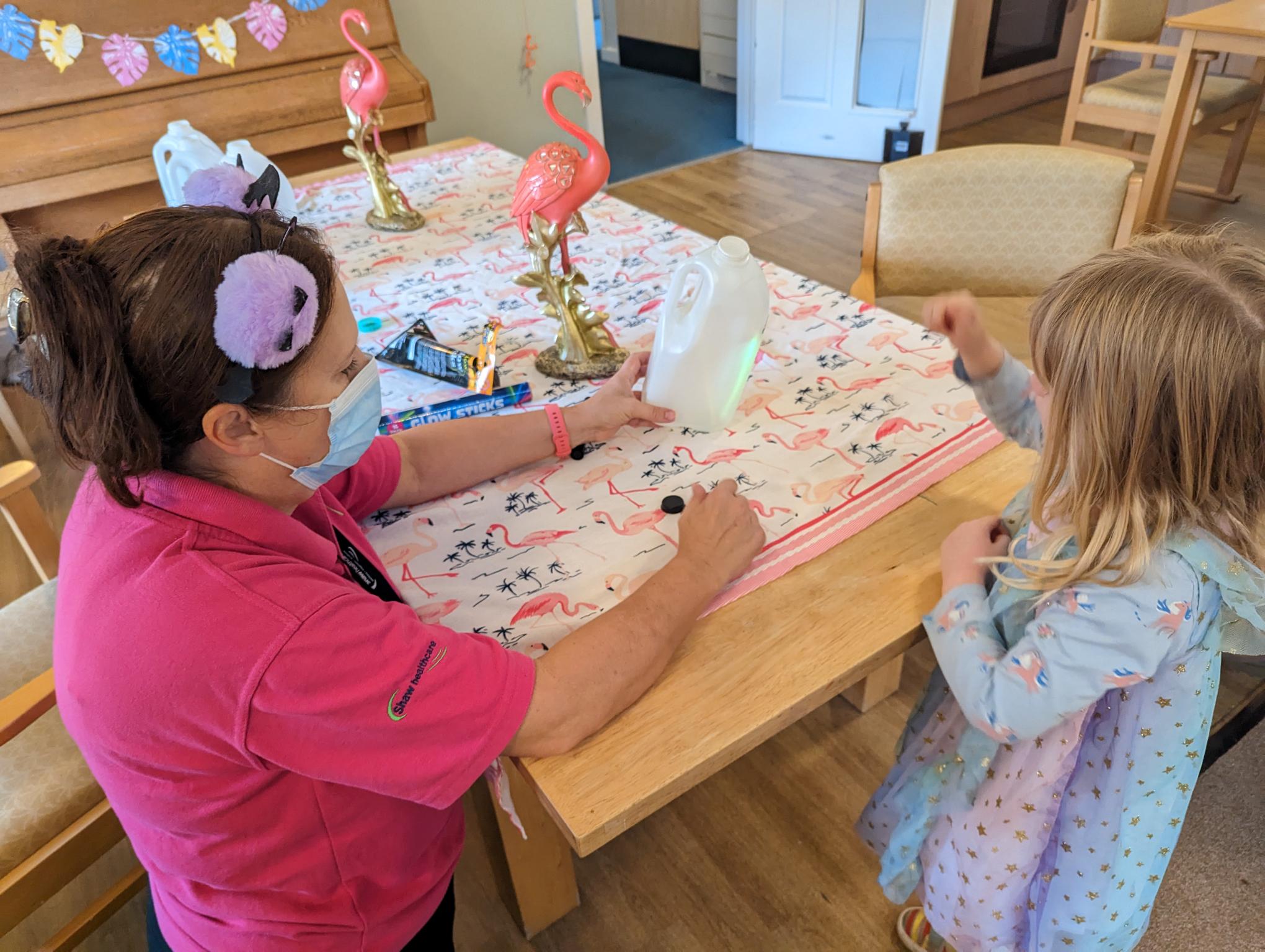 Green Roots Nursery taking part in arts and crafts with Glebe House residents 