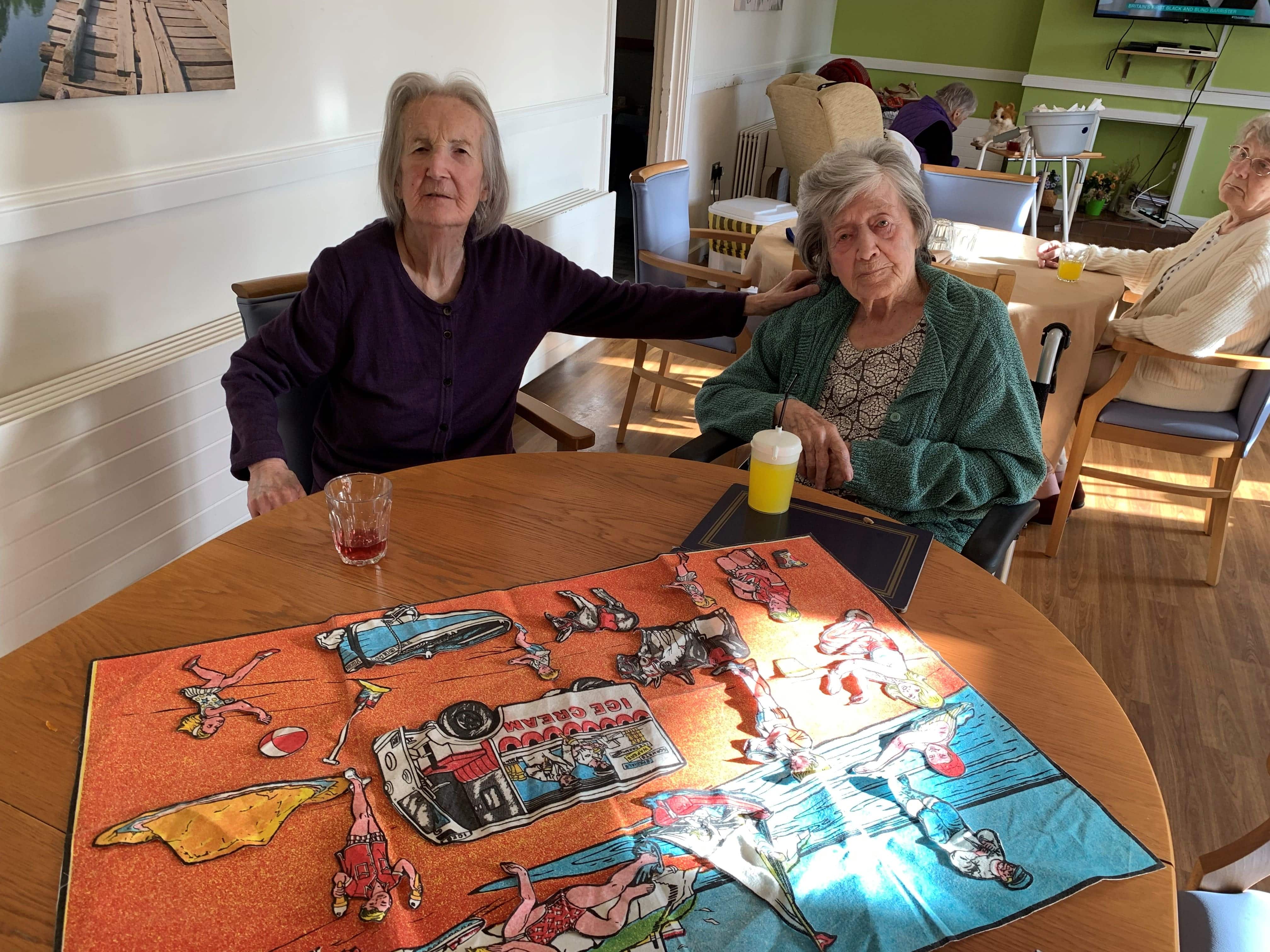 Barbara and Susan having a beach day inside with an interactive mat 