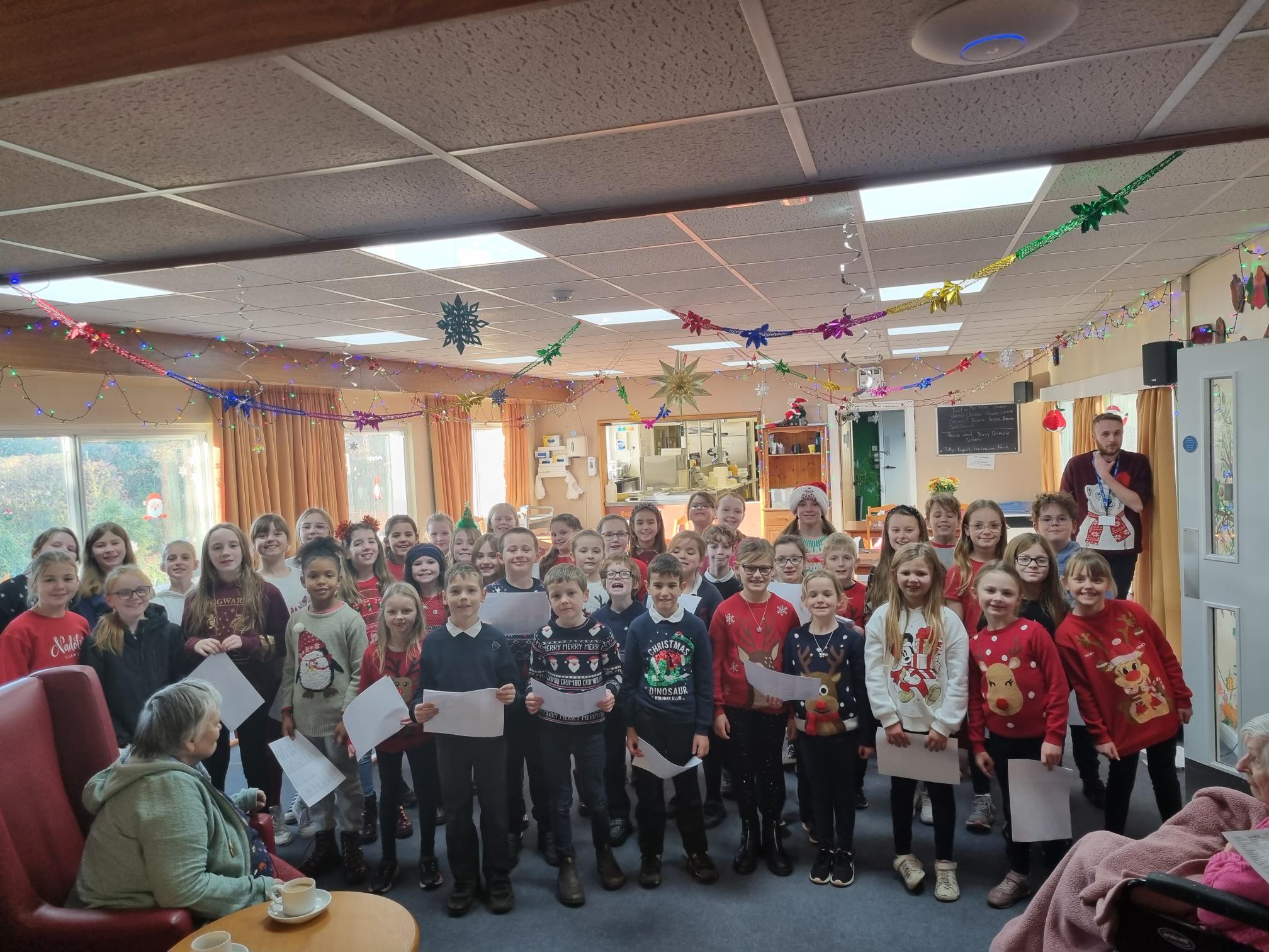 Llanfaes School Choir singing to residents