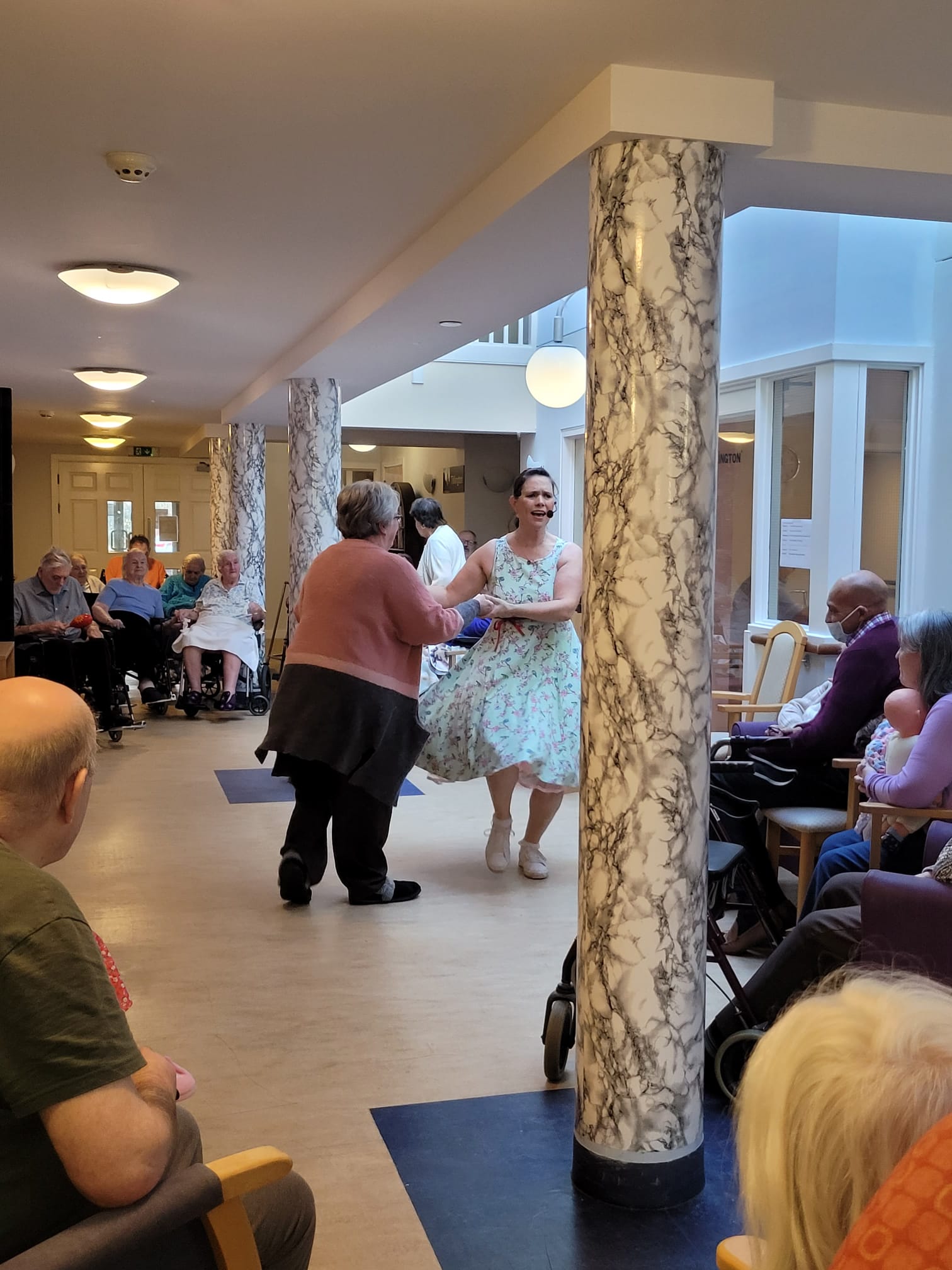 Jodie the entertainer dancing with resident 