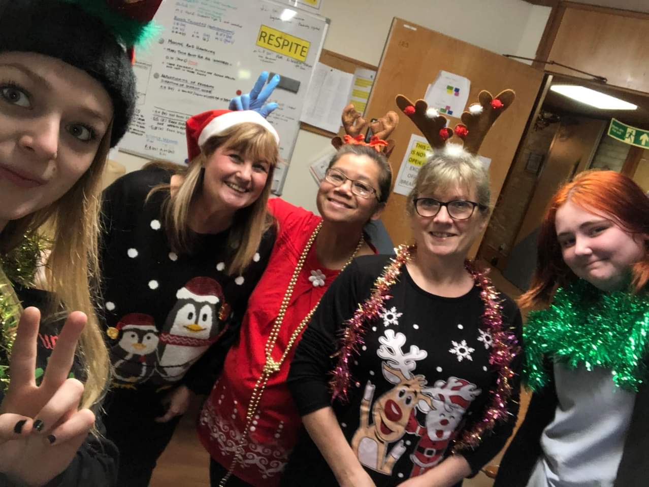 employees wearing Christmas jumpers
