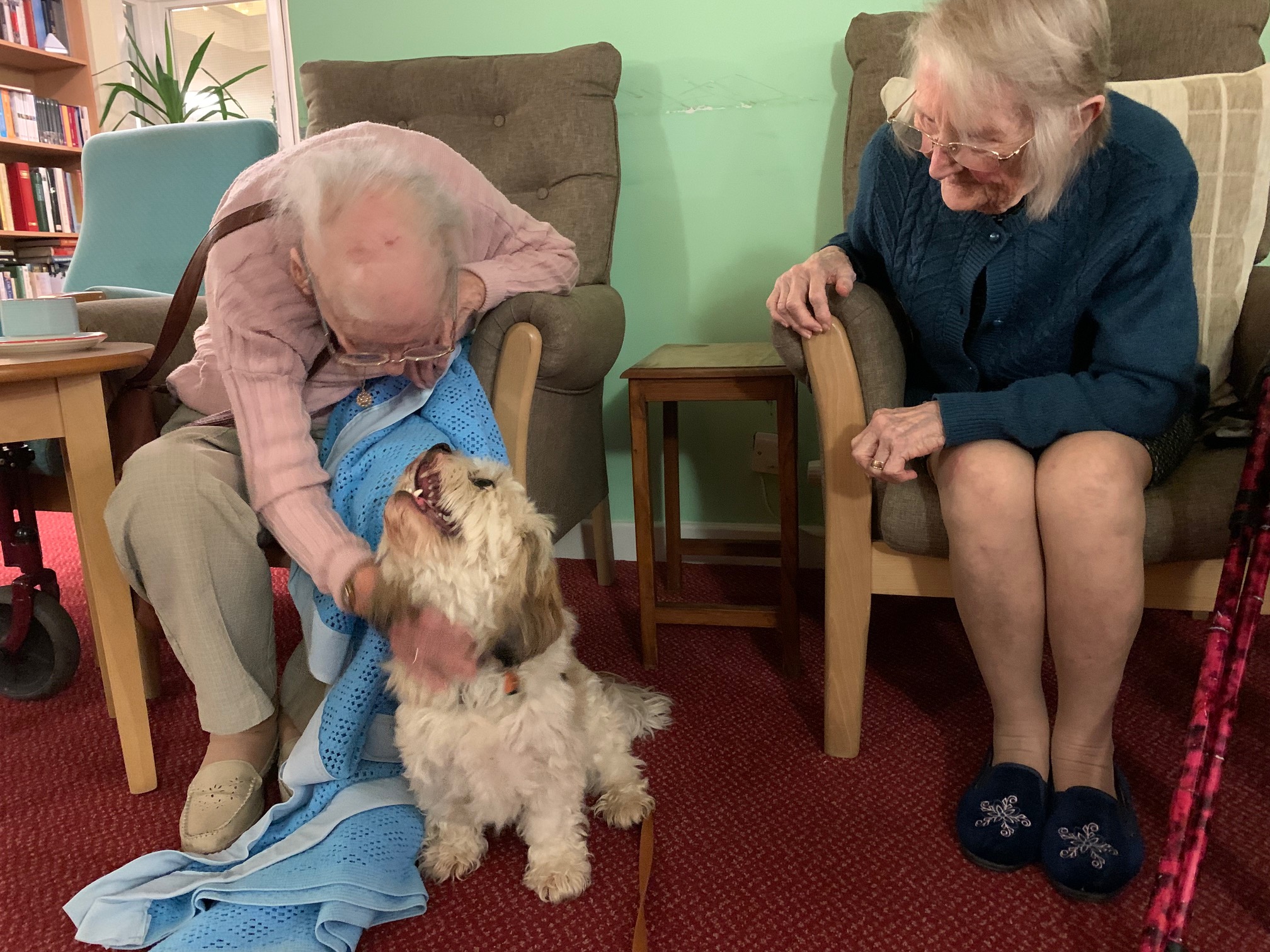 Residents with Bramble the Cavachon 