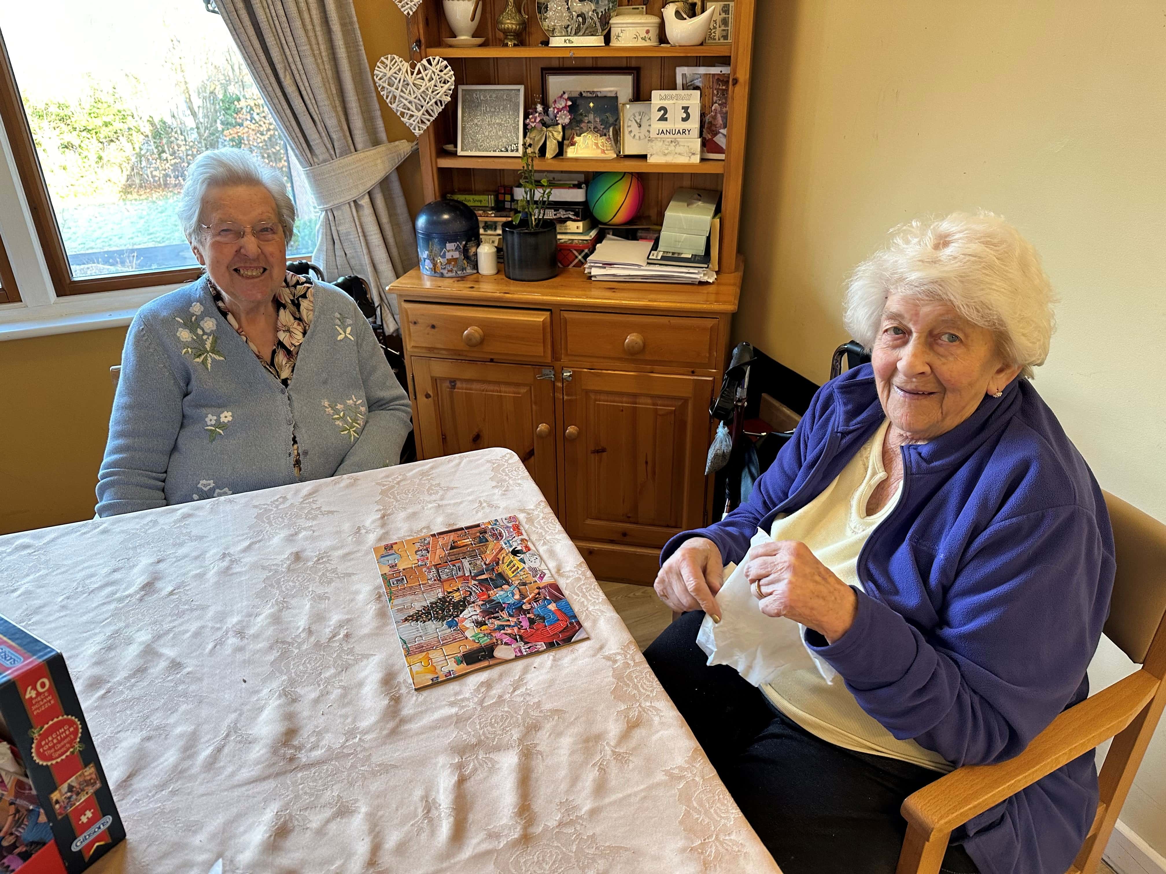 Ladies doing a jigsaw puzzle