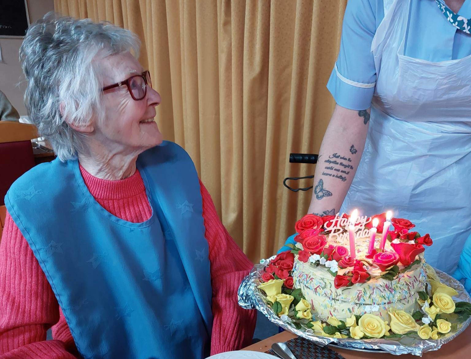 resident with her birthday cake