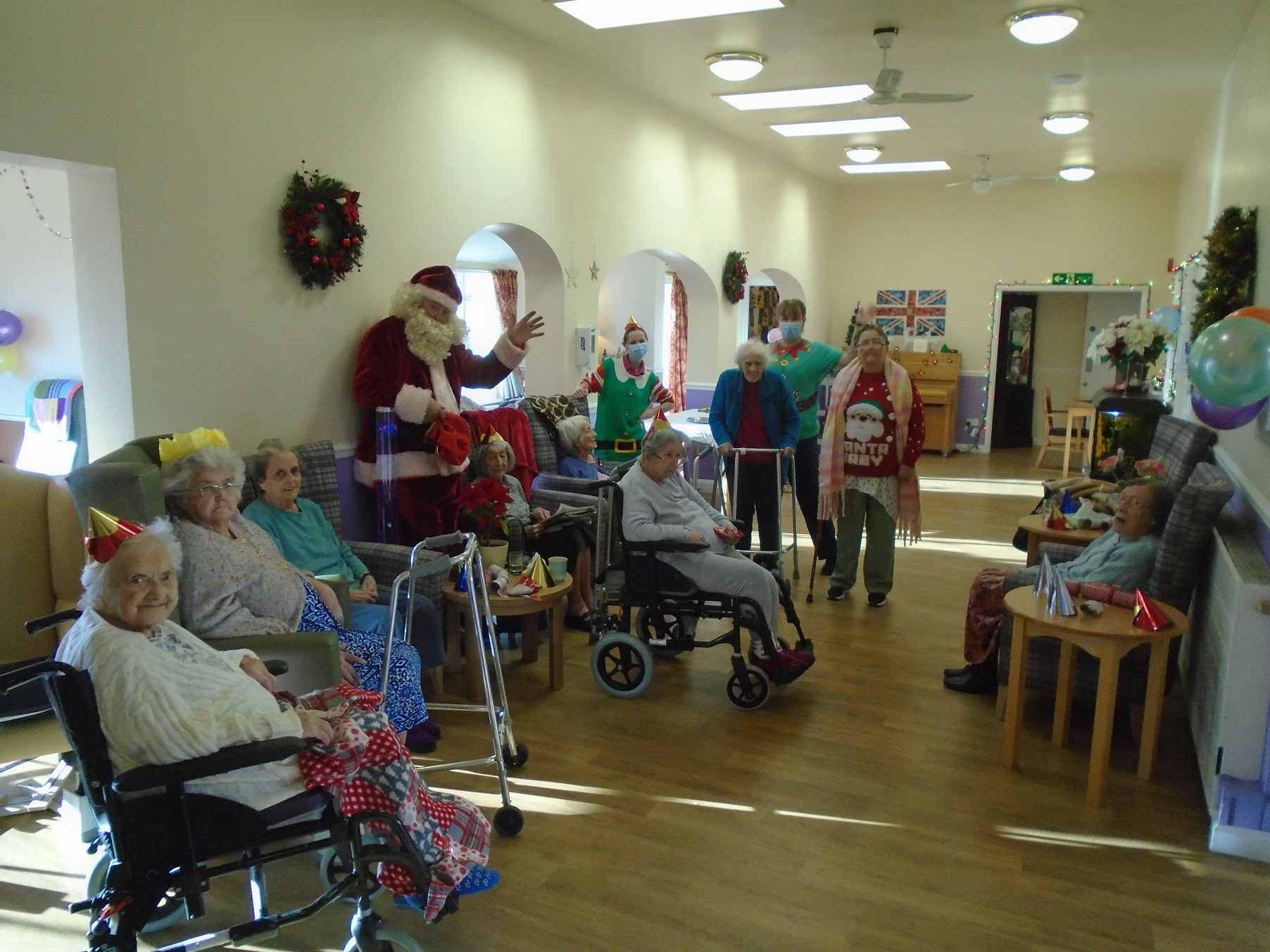 residents and employees with santa clause 
